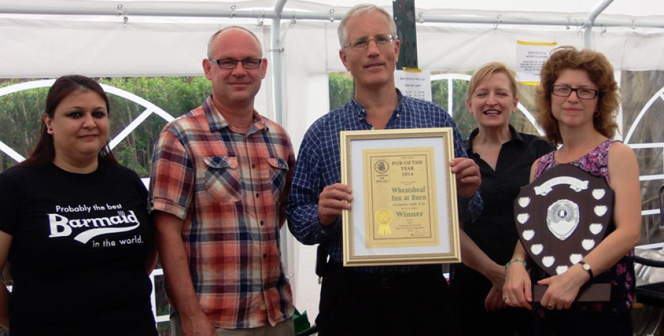 Pictured at the presentation are, from left: Barmaid Tara Fritsche, landlord Andy Howdall, York CAMRA chairman Christopher Tregellis, cook Sheila Mansbridge and landlady Jo Mose