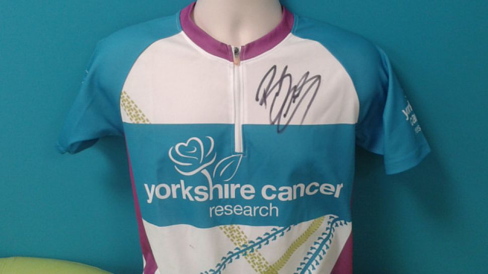 The Yorkshire Cancer Research cycling top signed by Sir Bradley Wiggins
