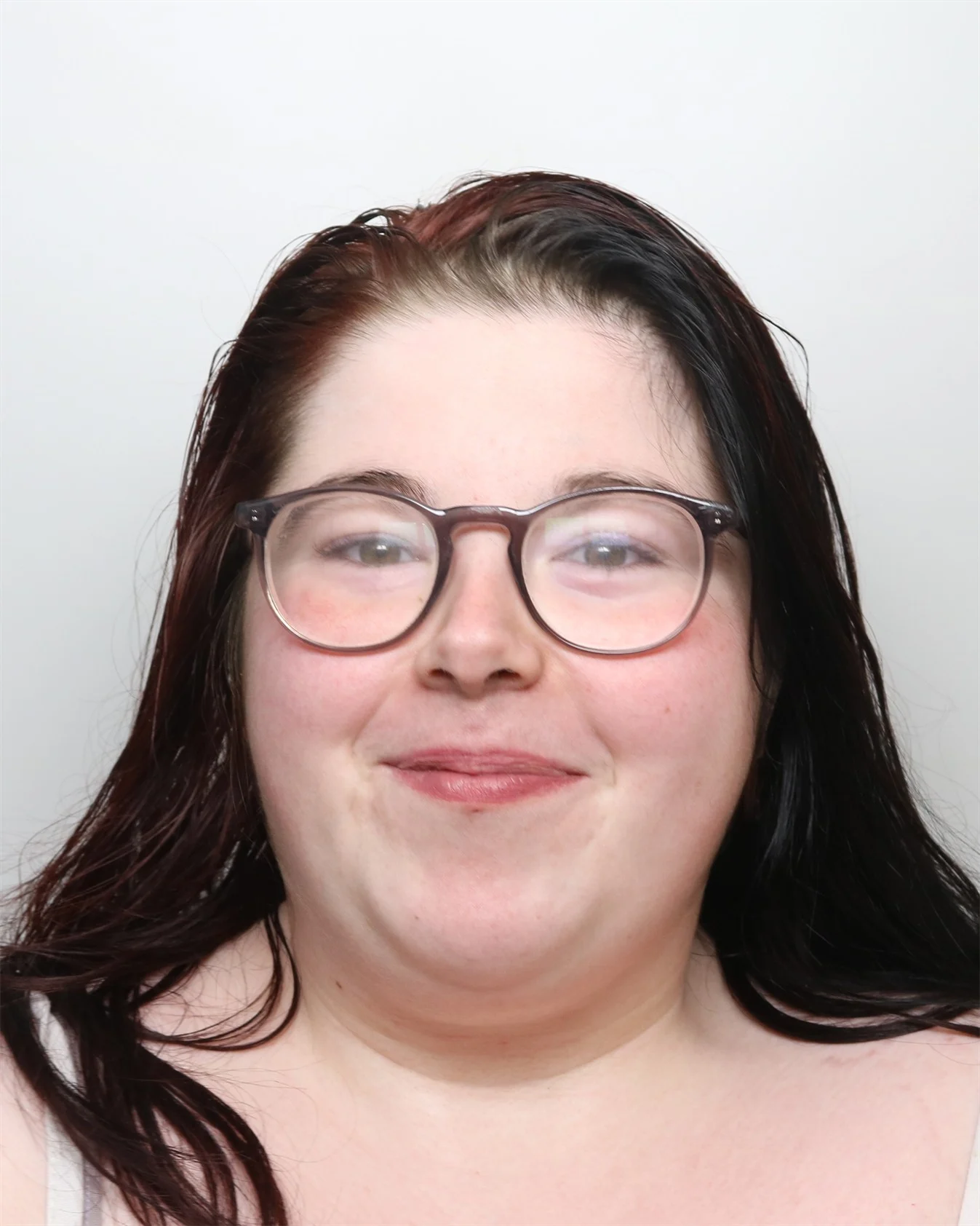 Smirking woman locked up after threatening 999 workers with broken bottle